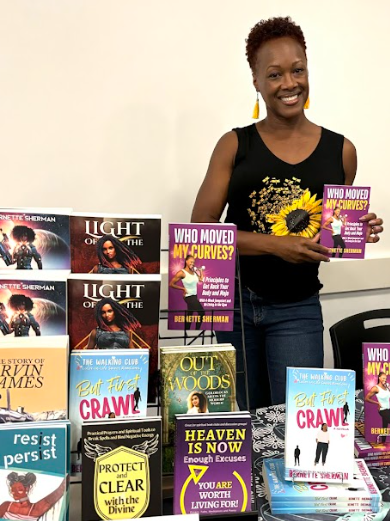 Bernette Sherman with several of her books at a local author fair.