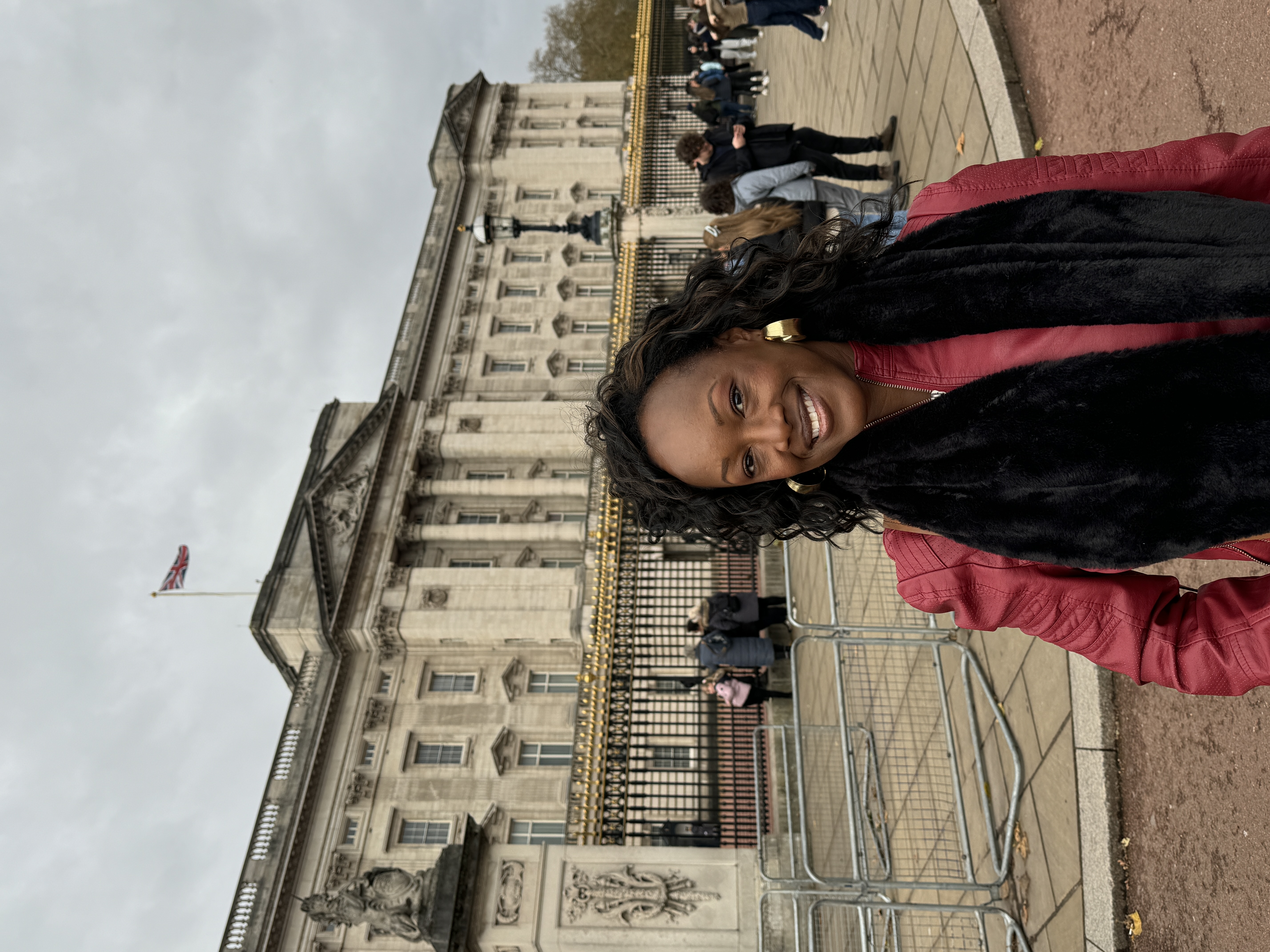 The author, Bernette, at Buckingham Palace on her otherworldly London vacation.